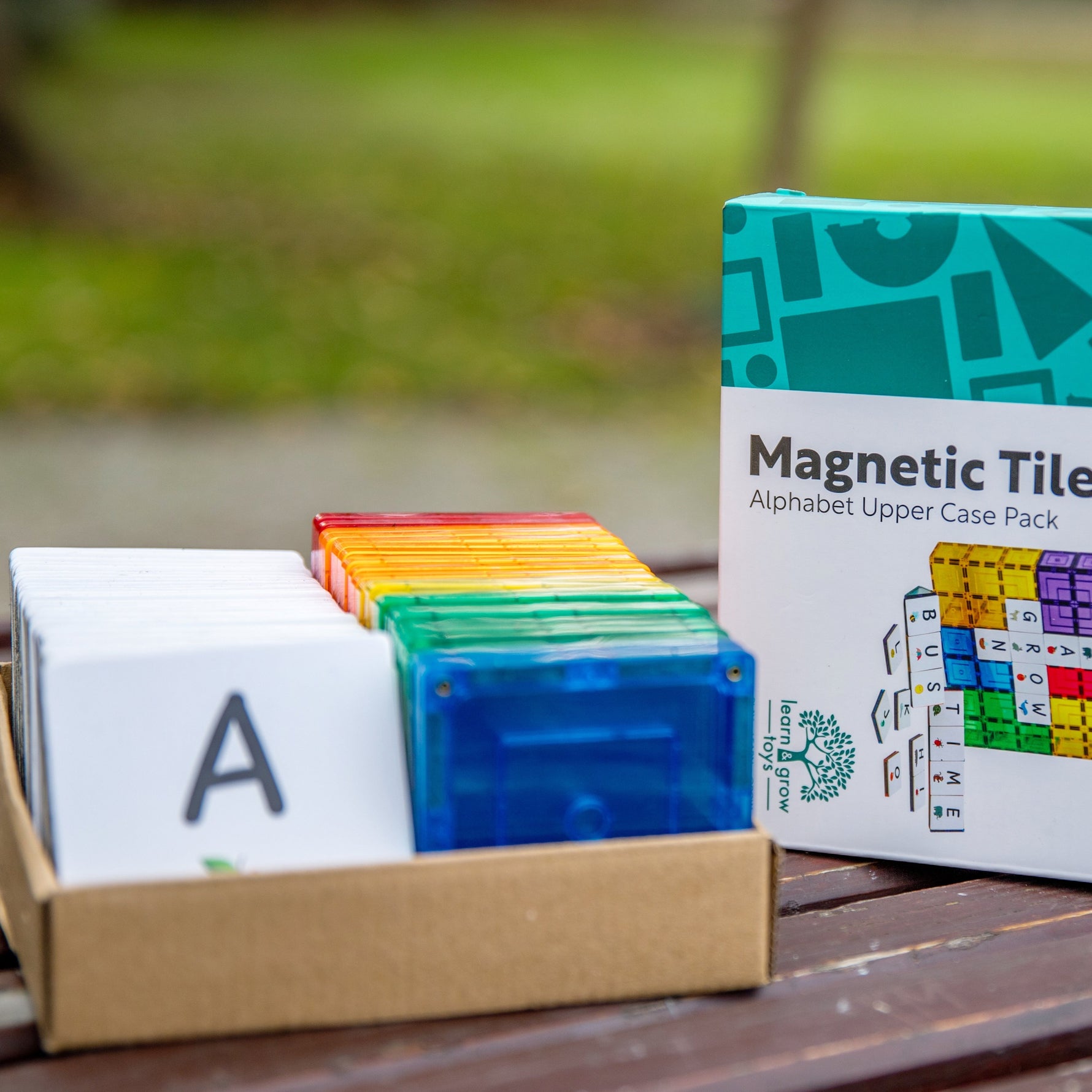 Upper case A on display in box with colourful magnetic tiles