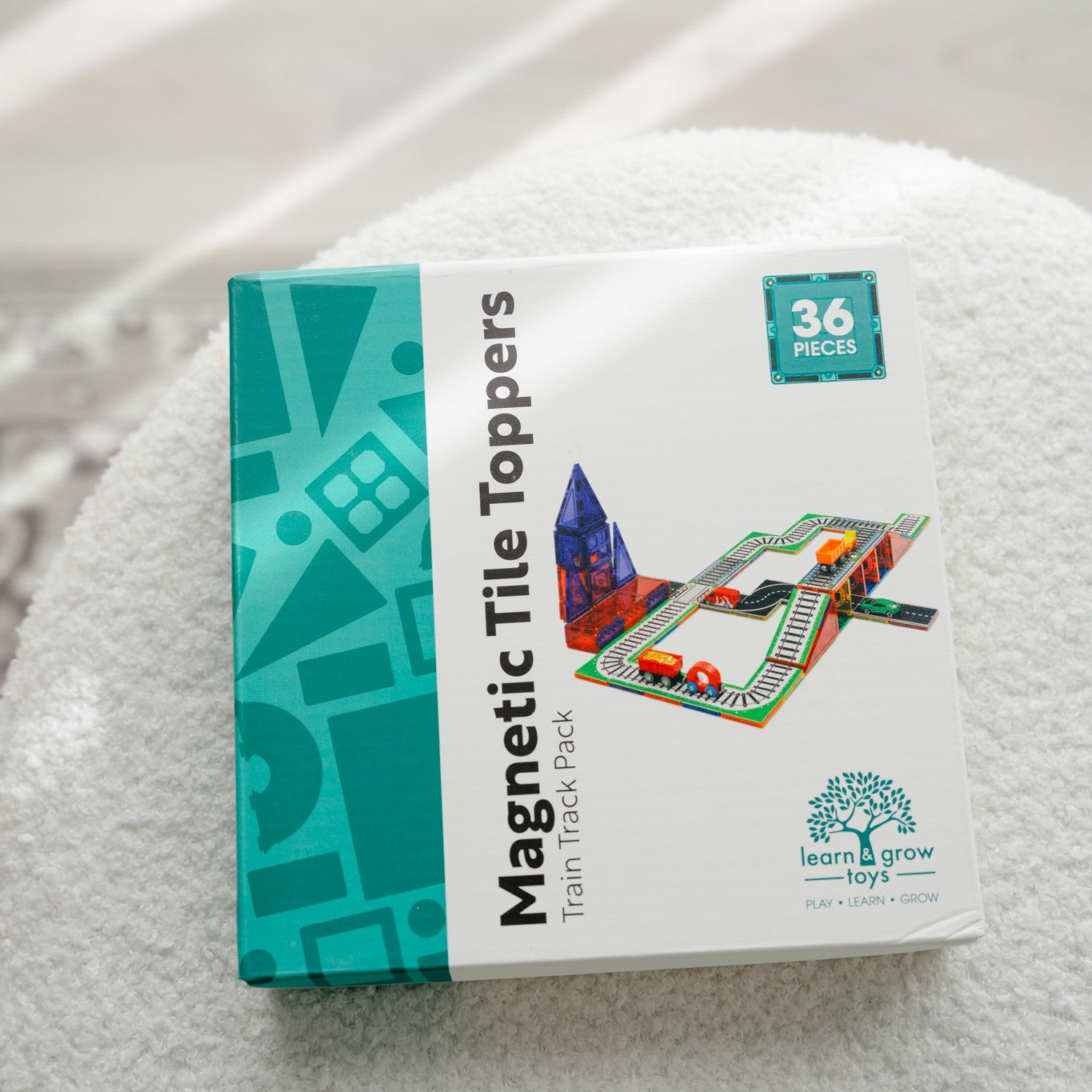 Magnetic tile toppers train pack sitting on seat